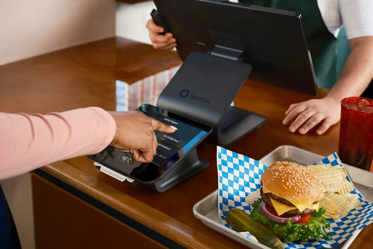 A customer asking for something at a takeout counter
