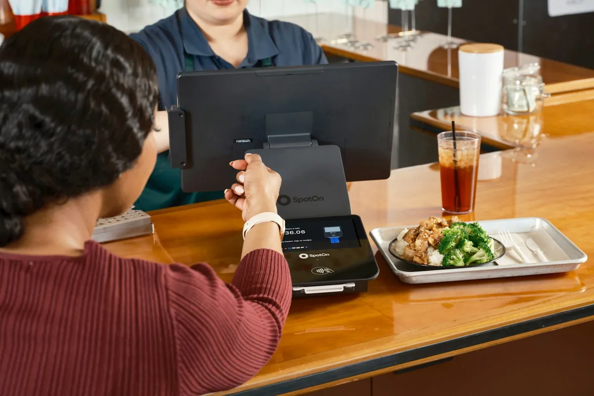 A customer asking staff a question at the counter