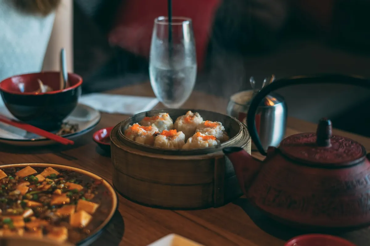 Several Chinese dishes arranged together on a table