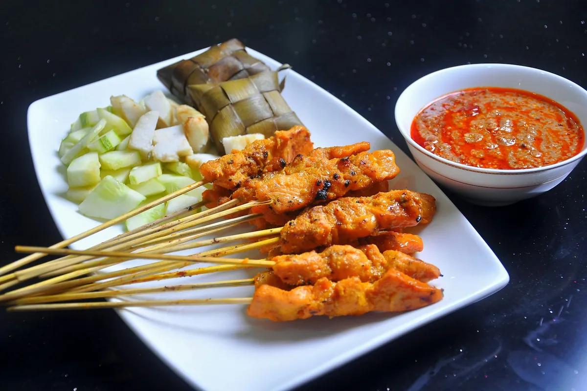 Meat threaded onto bamboo skewers