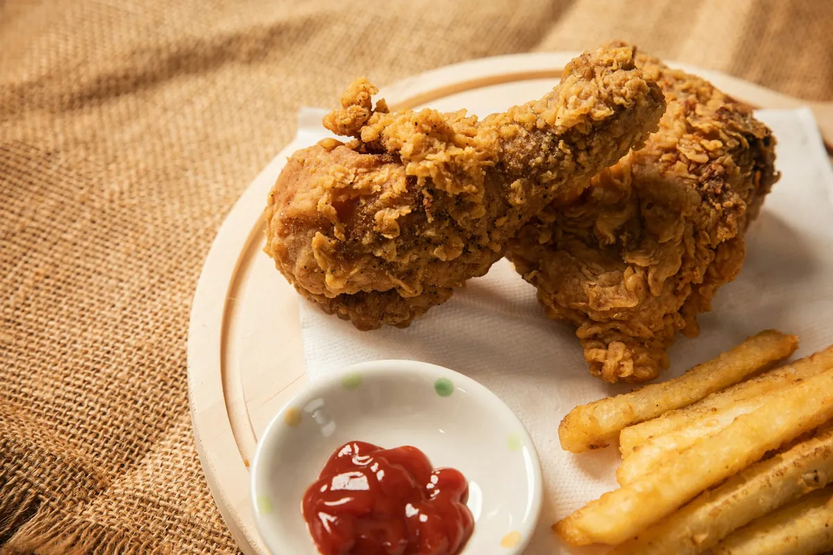 Battered chicken pieces fried before saucing