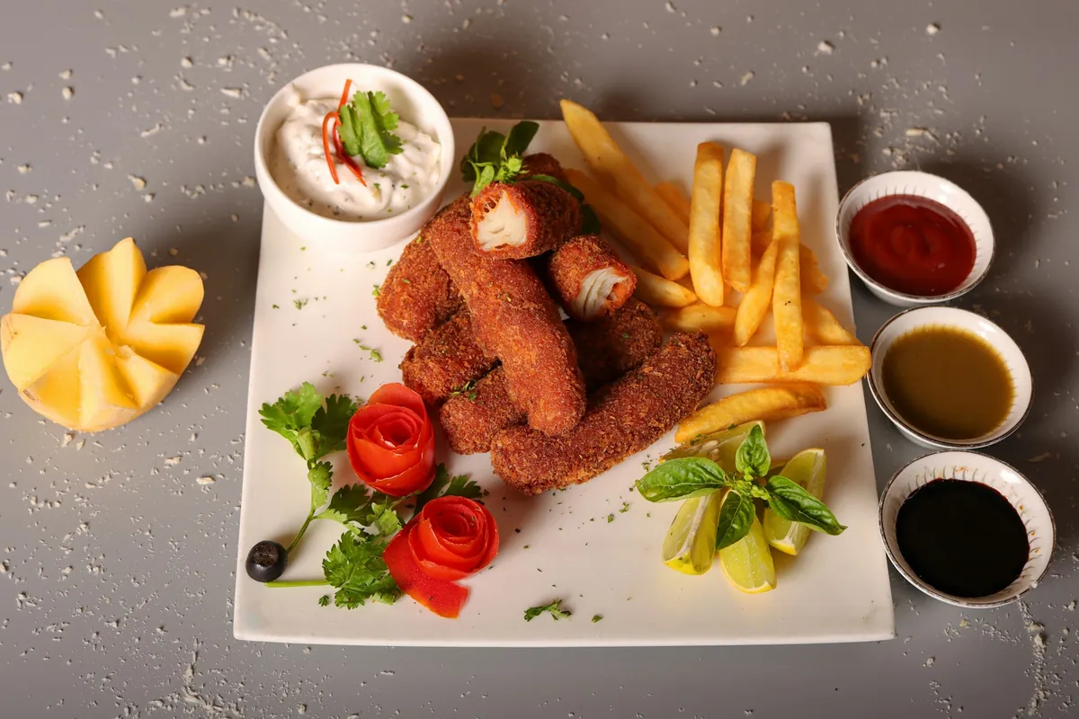 Battered and fried seafood sticks on a plate