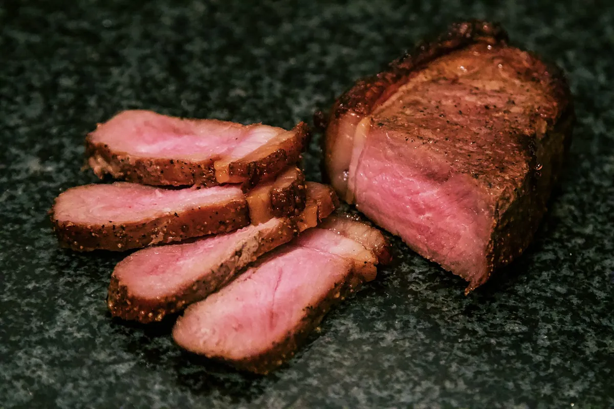Sliced beef coated in a savory sauce
