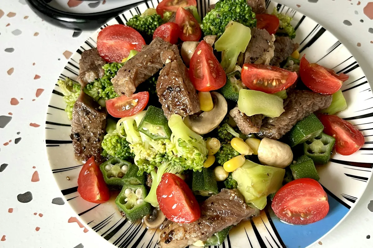 A glazed chicken dish served with broccoli