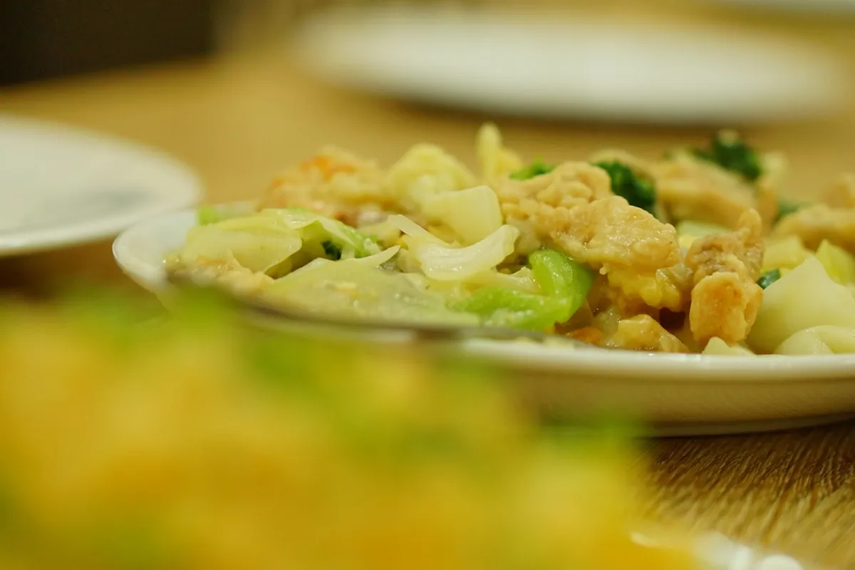 Chicken and broccoli cooked together in a light sauce