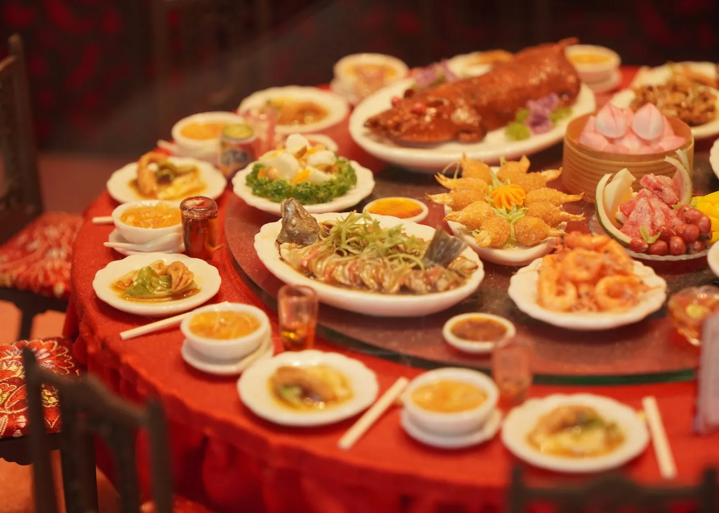 A banquet table laid with an assortment of Chinese dishes