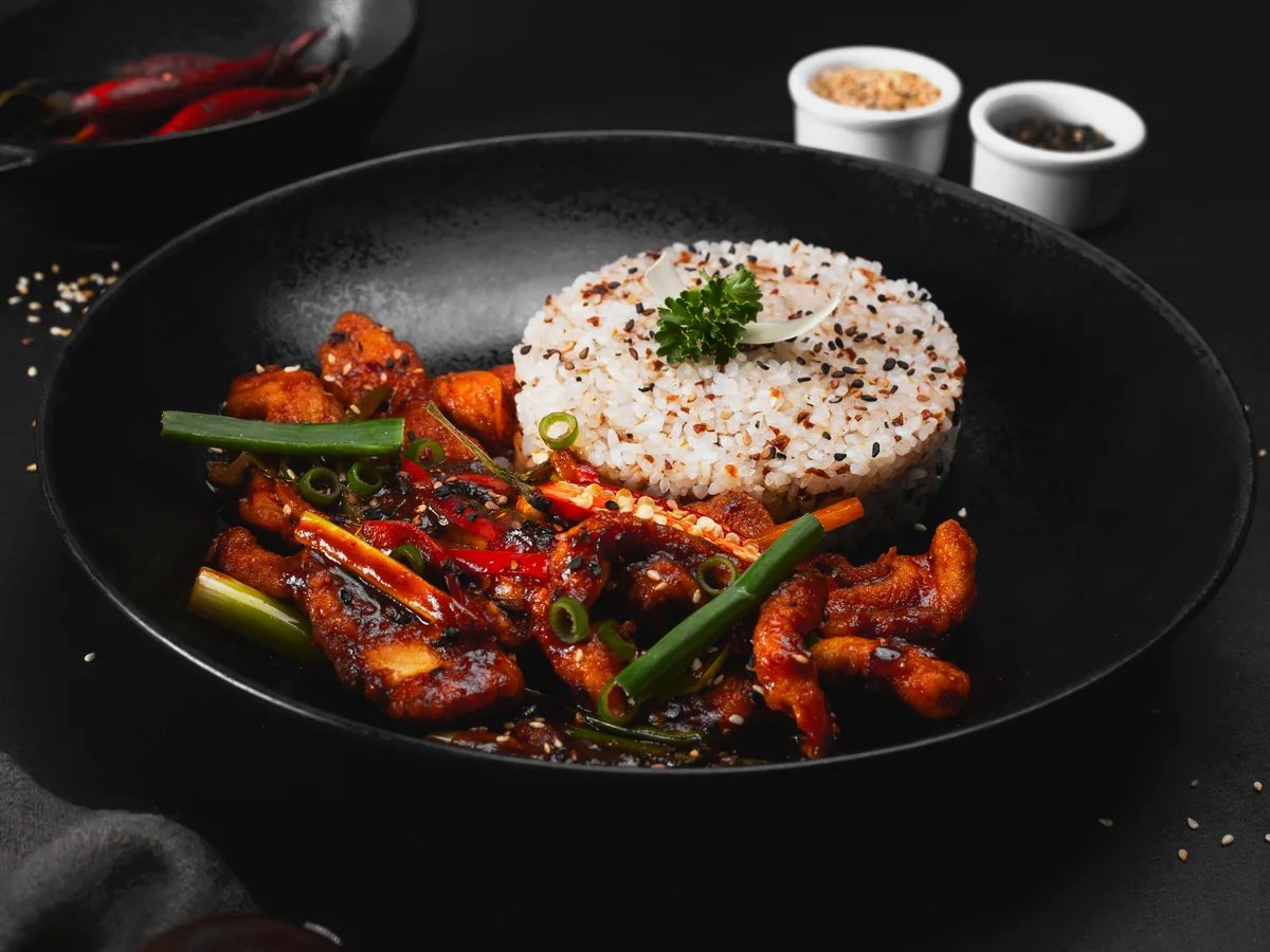 Spicy stir-fried chicken served with rice