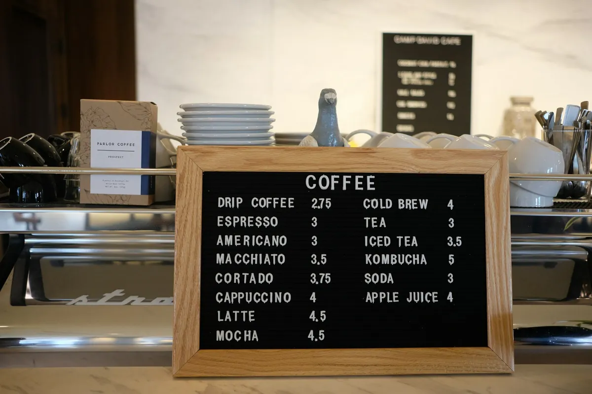 A drinks menu board showing options