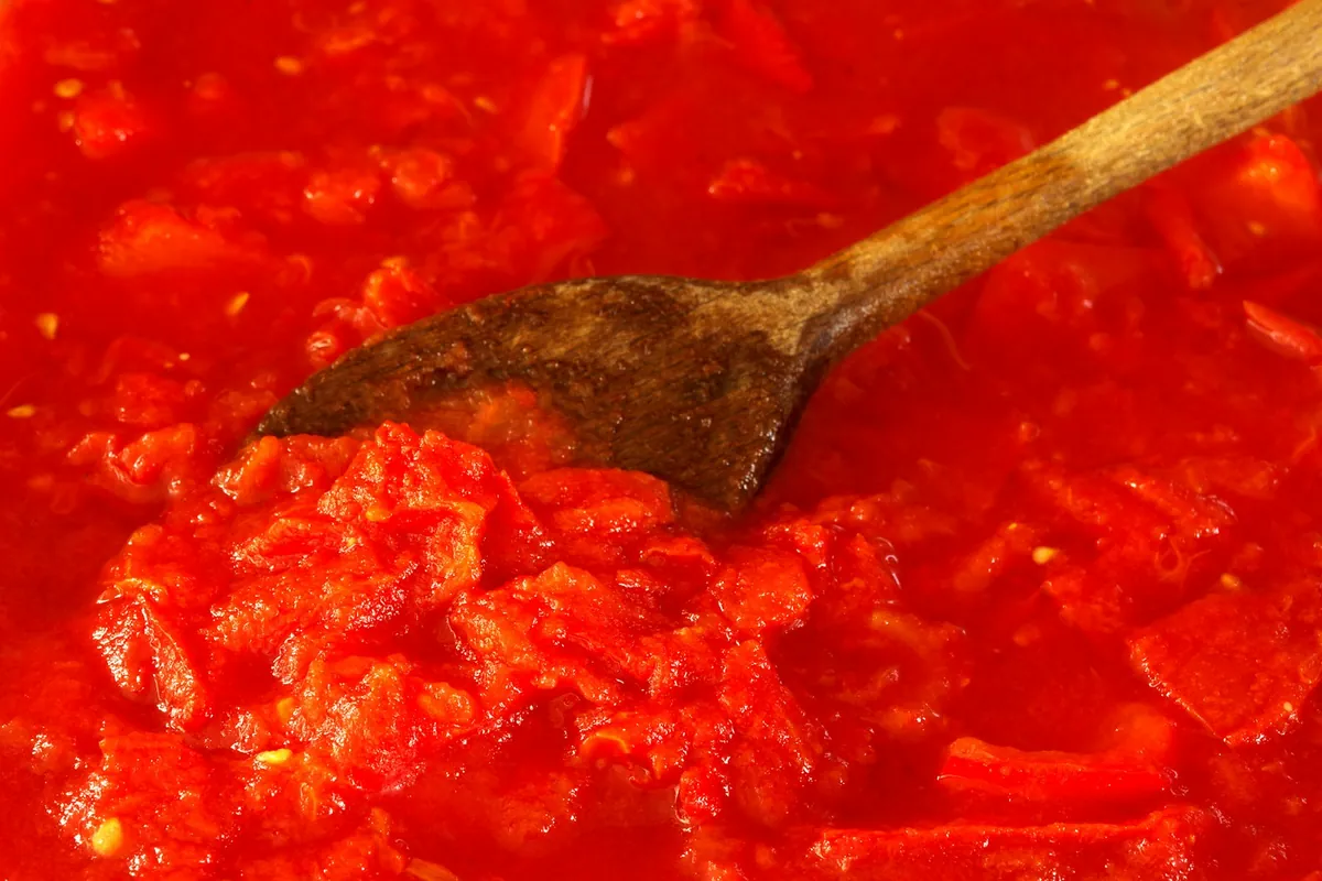 Chunky savory sauce on a spoon