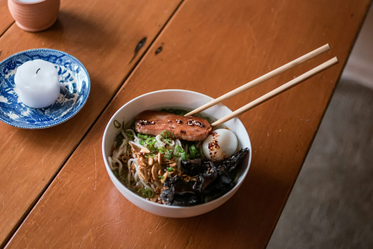 A sweet chicken dish served beside plain steamed rice