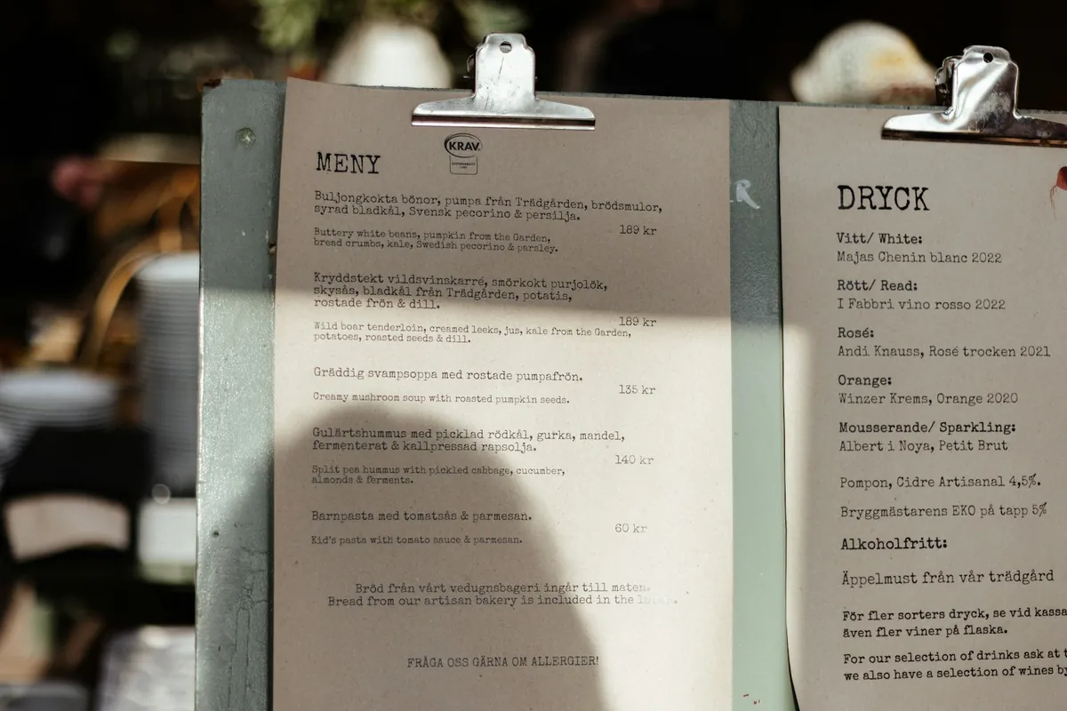 A customer reading a menu at a restaurant
