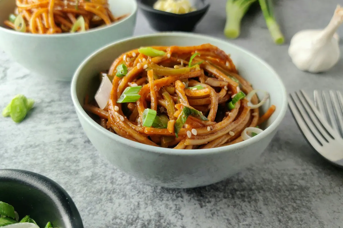 Dried red chilies among stir-fried ingredients