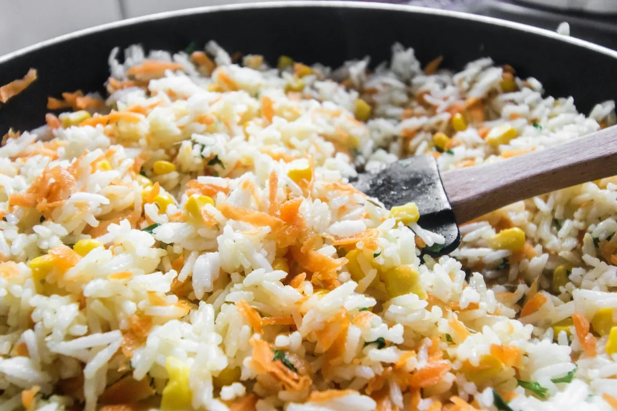 Fried rice with separate grains and diced vegetables