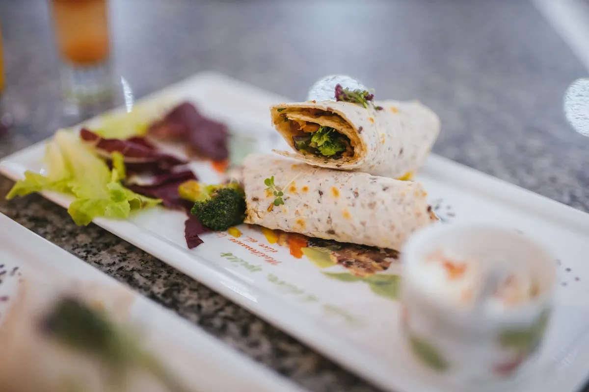A pancake rolled around duck, cucumber and scallion