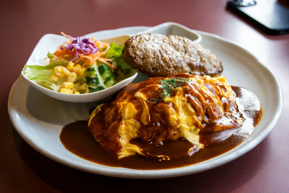 A thick egg patty served with a brown gravy