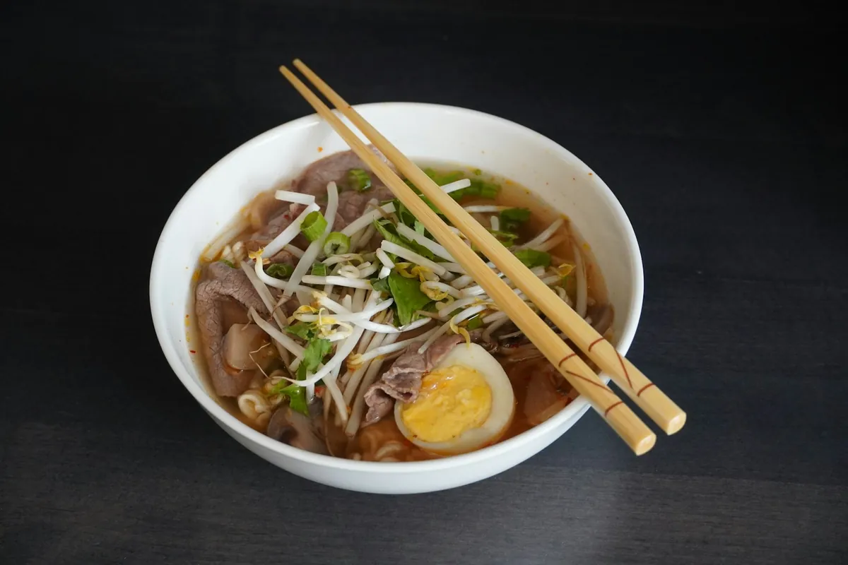 A thickened soup with fine ribbons of egg through it