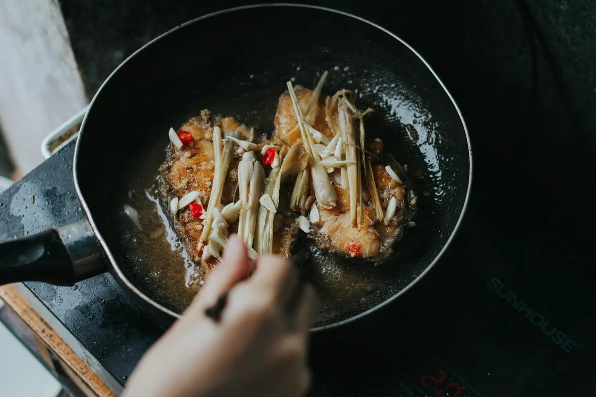 Food cooking in a pan in a small batch