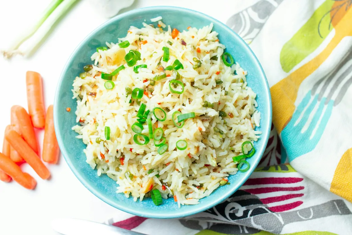 Close view of fried rice showing separate grains and diced vegetables