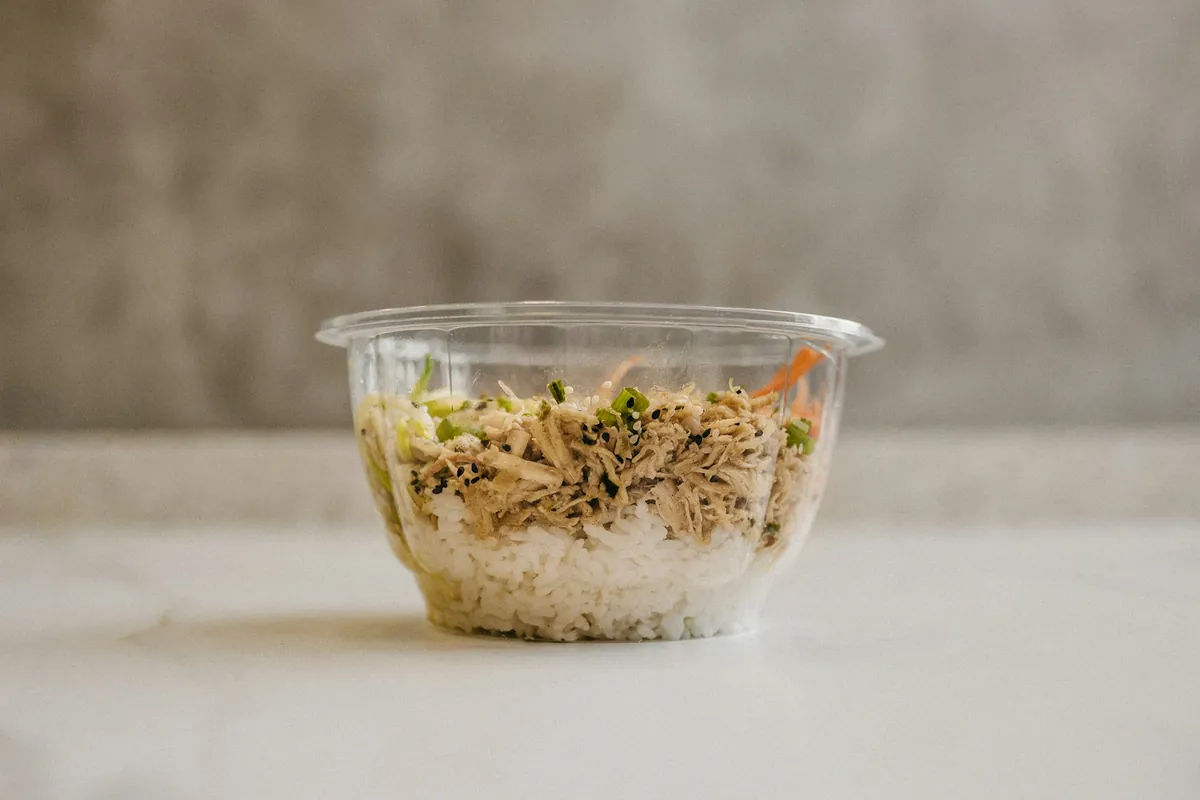 A takeout portion of fried rice in a container