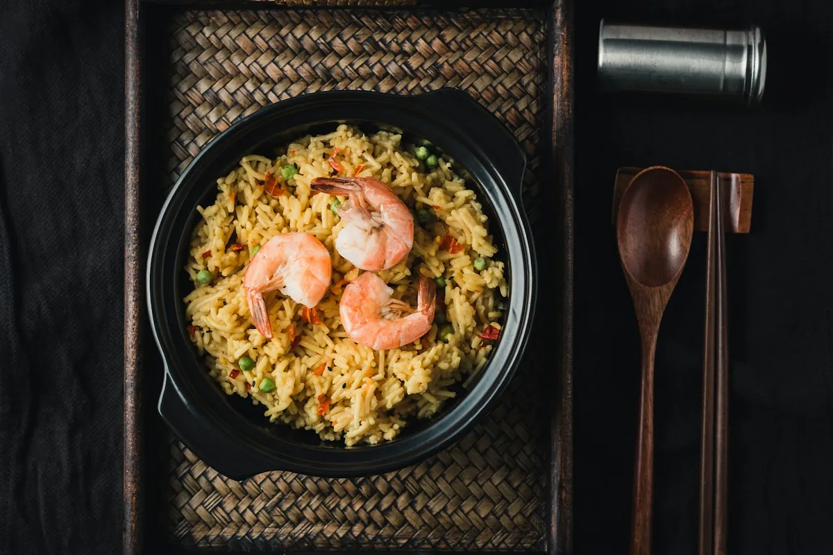 Fried rice served with shrimp and scallions