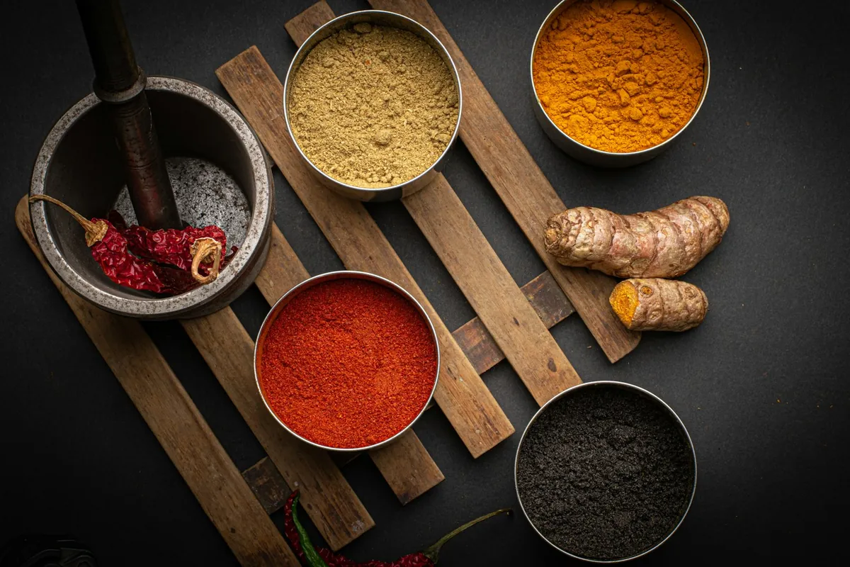 Spices being ground with a mortar and pestle