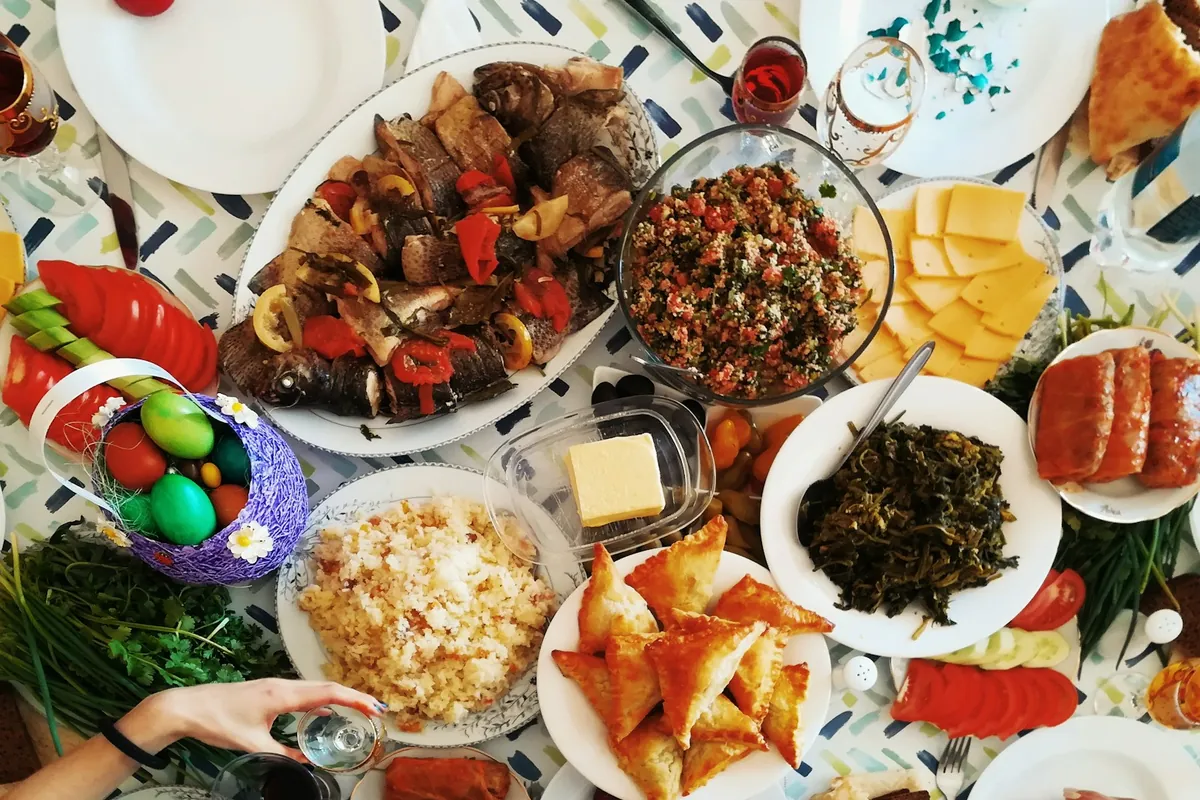 A group sharing a tray of appetizers at a table