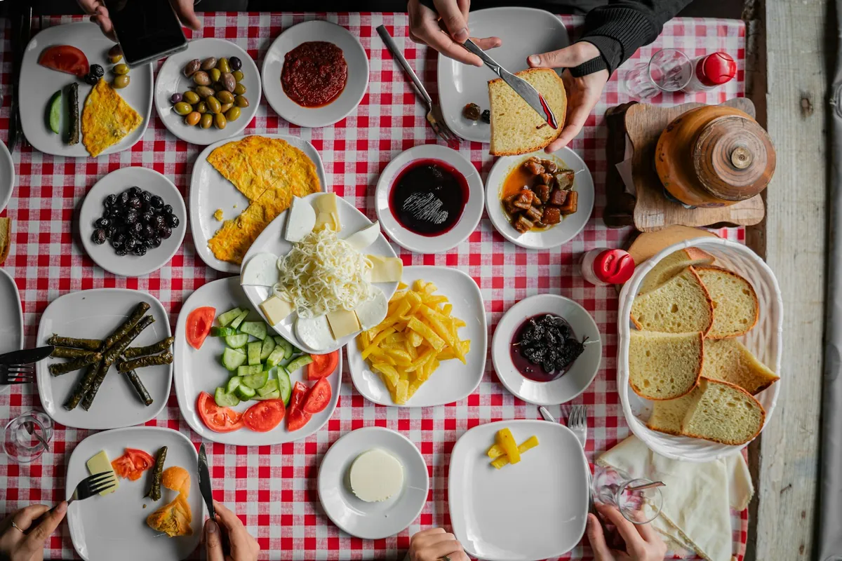 A large group sharing a meal around one table