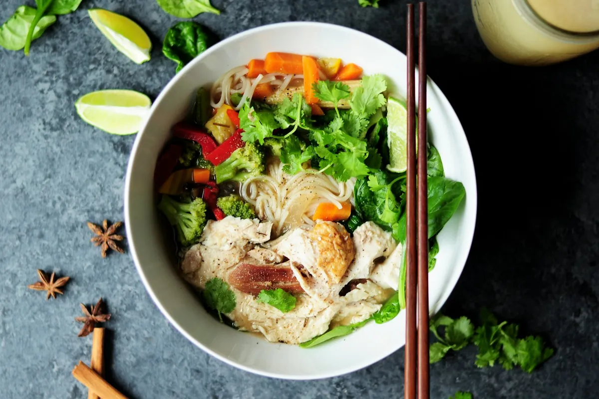A clear soup with mixed vegetables