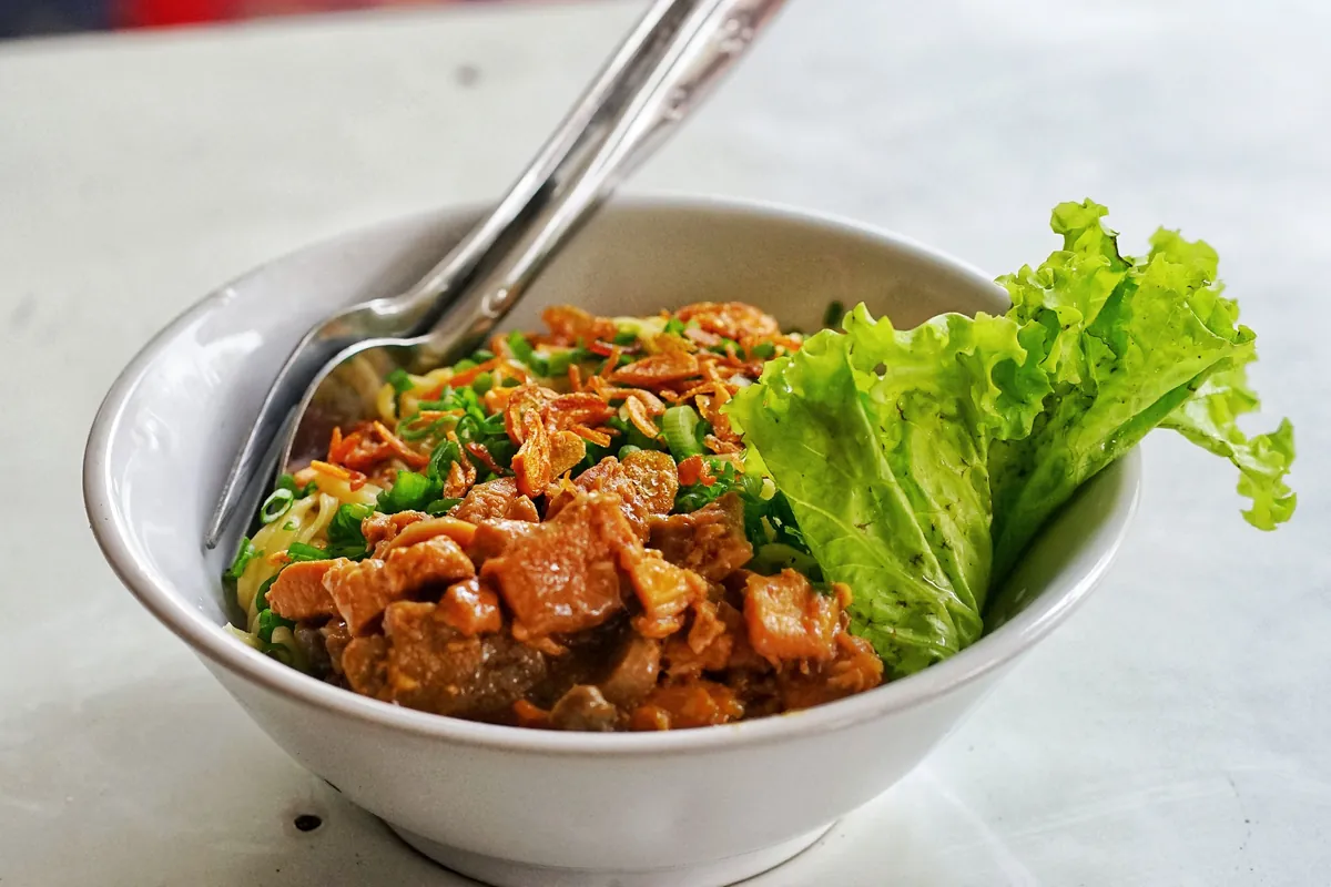 Soft sauced noodles served with a crisp fried item