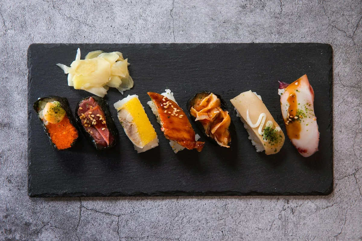 A mixed platter of Chinese appetizers with dipping sauce