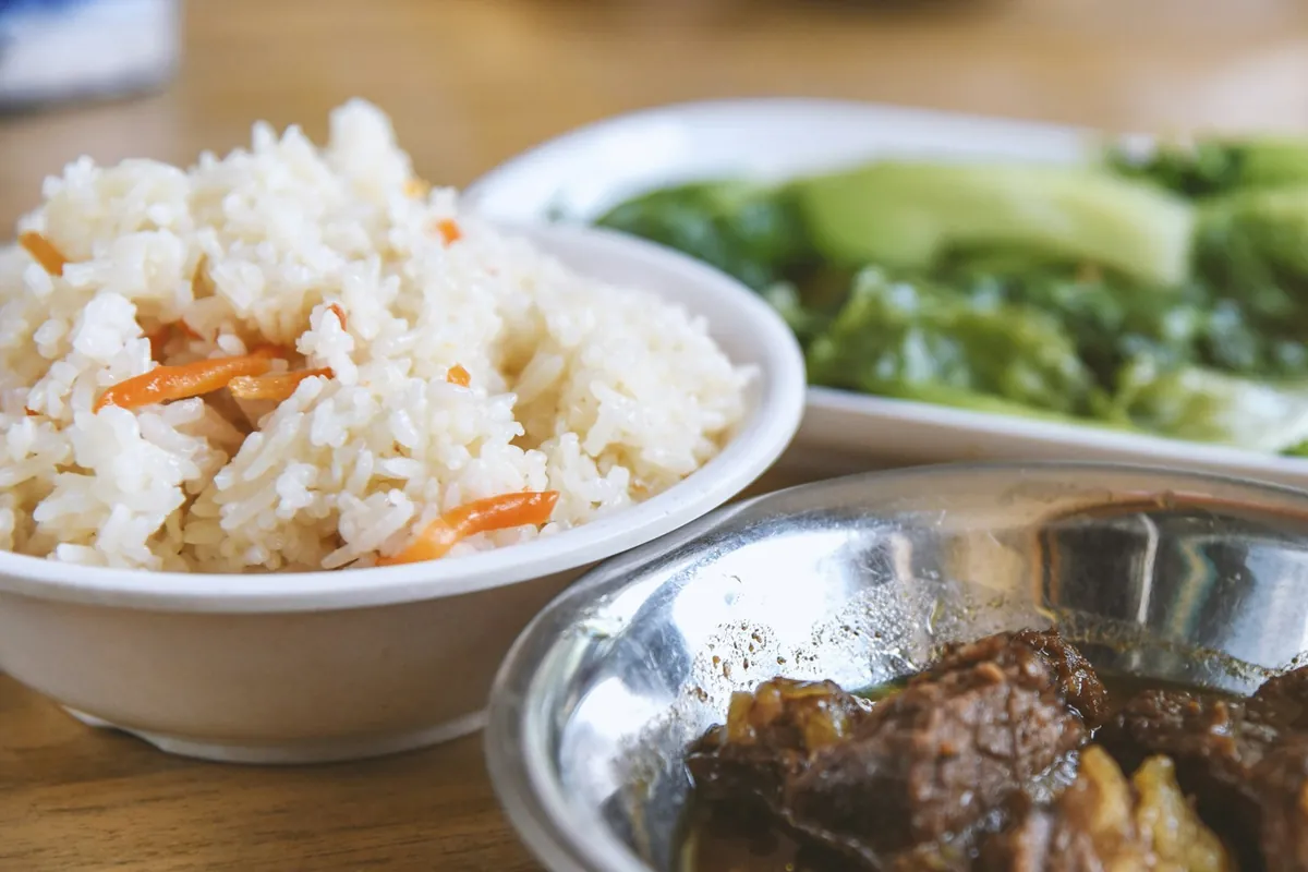 A mixed platter packed in a takeout container