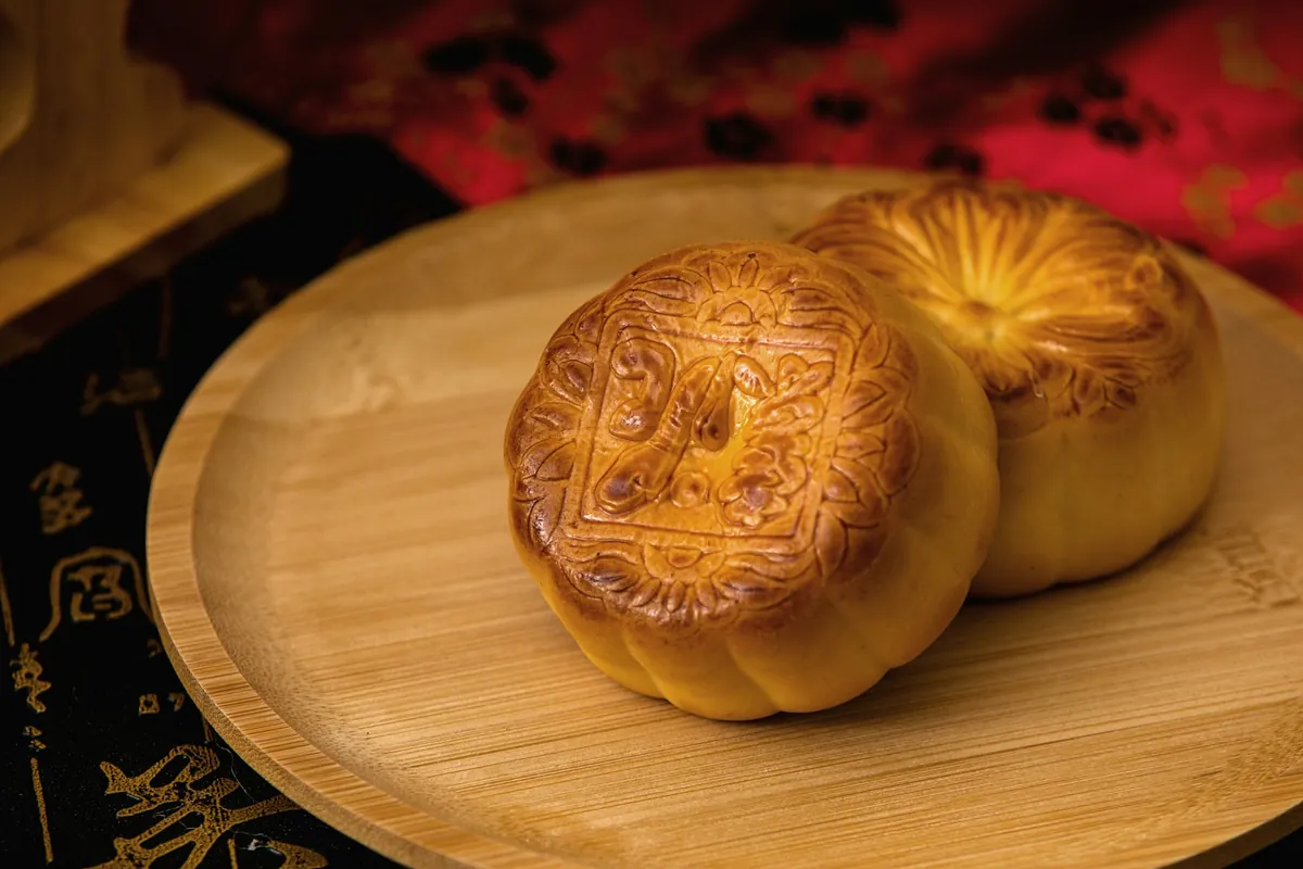 A mooncake showing its stamped surface pattern