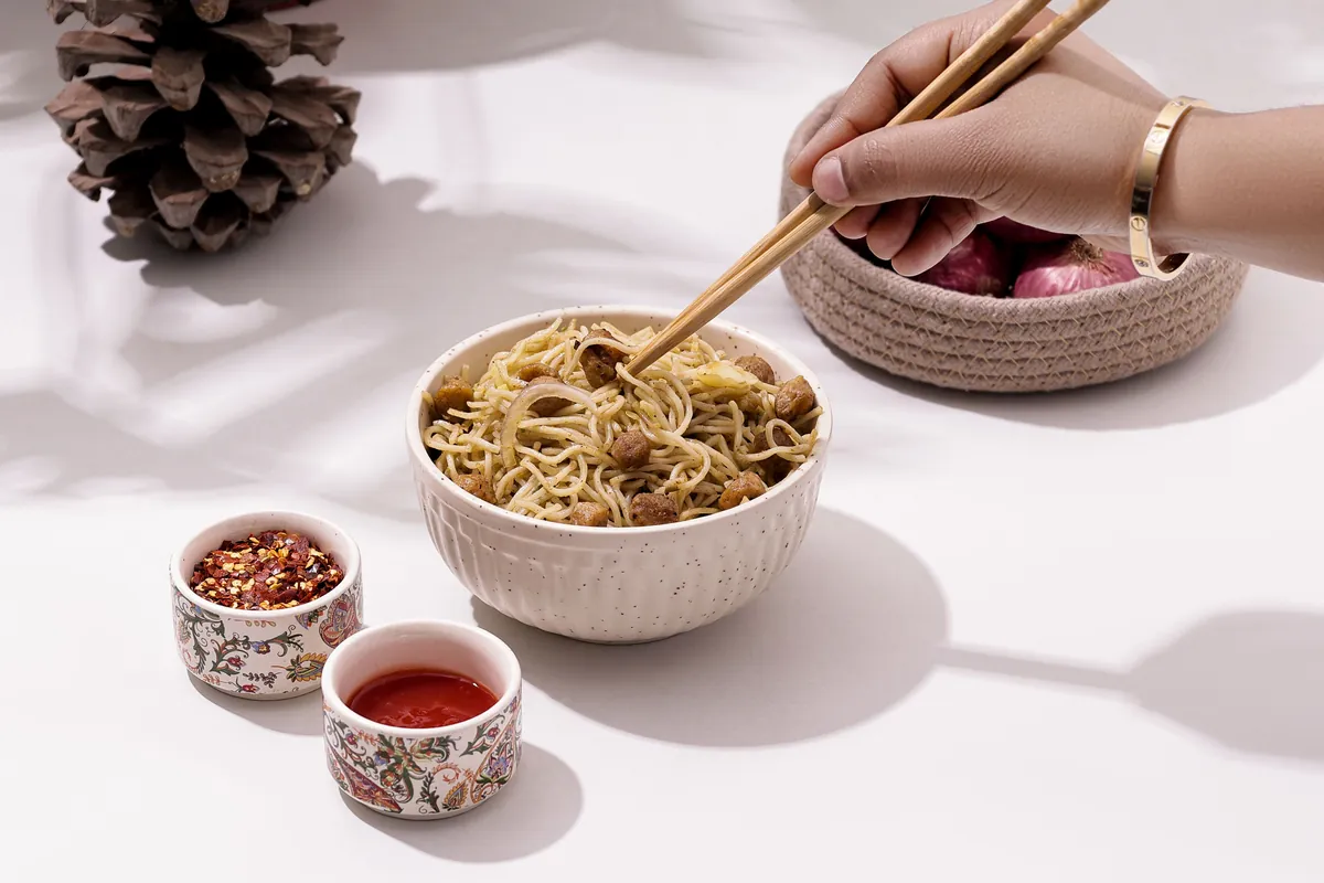 Noodles heavily coated in a glossy sauce