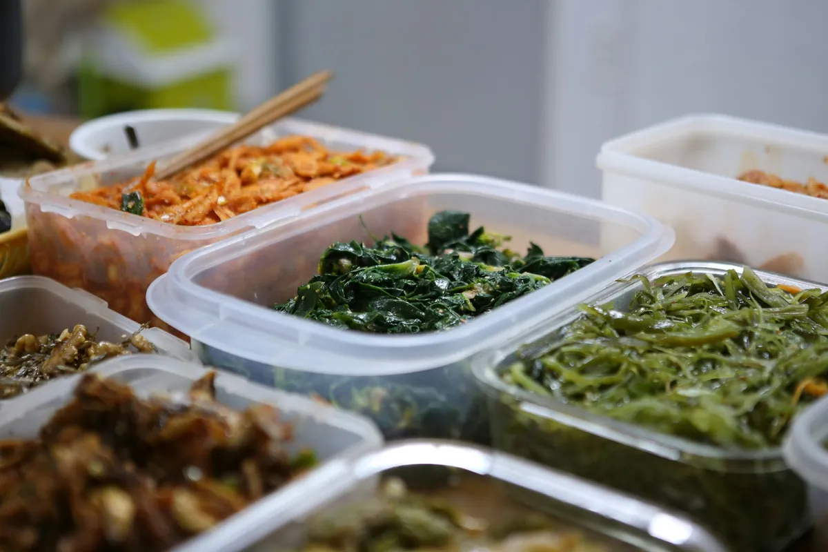 A takeout order being packed at a counter