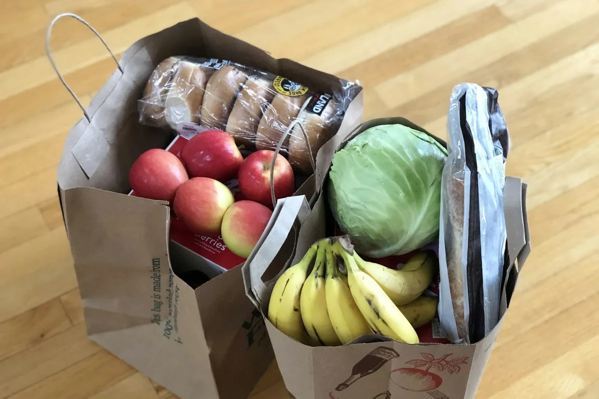 Takeout containers being packed for an order