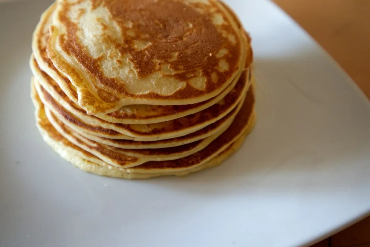 A thin pancake with sauce spread on it