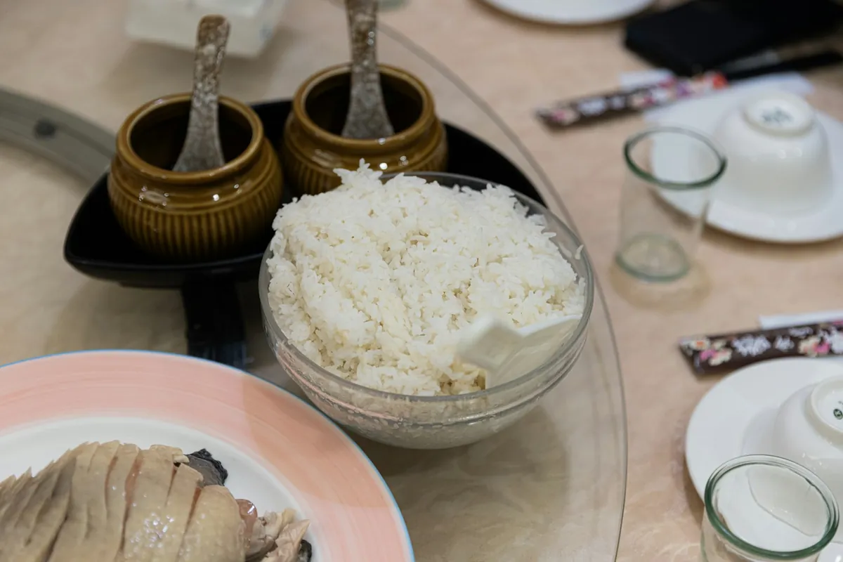 Plain steamed rice served with a sauced dish