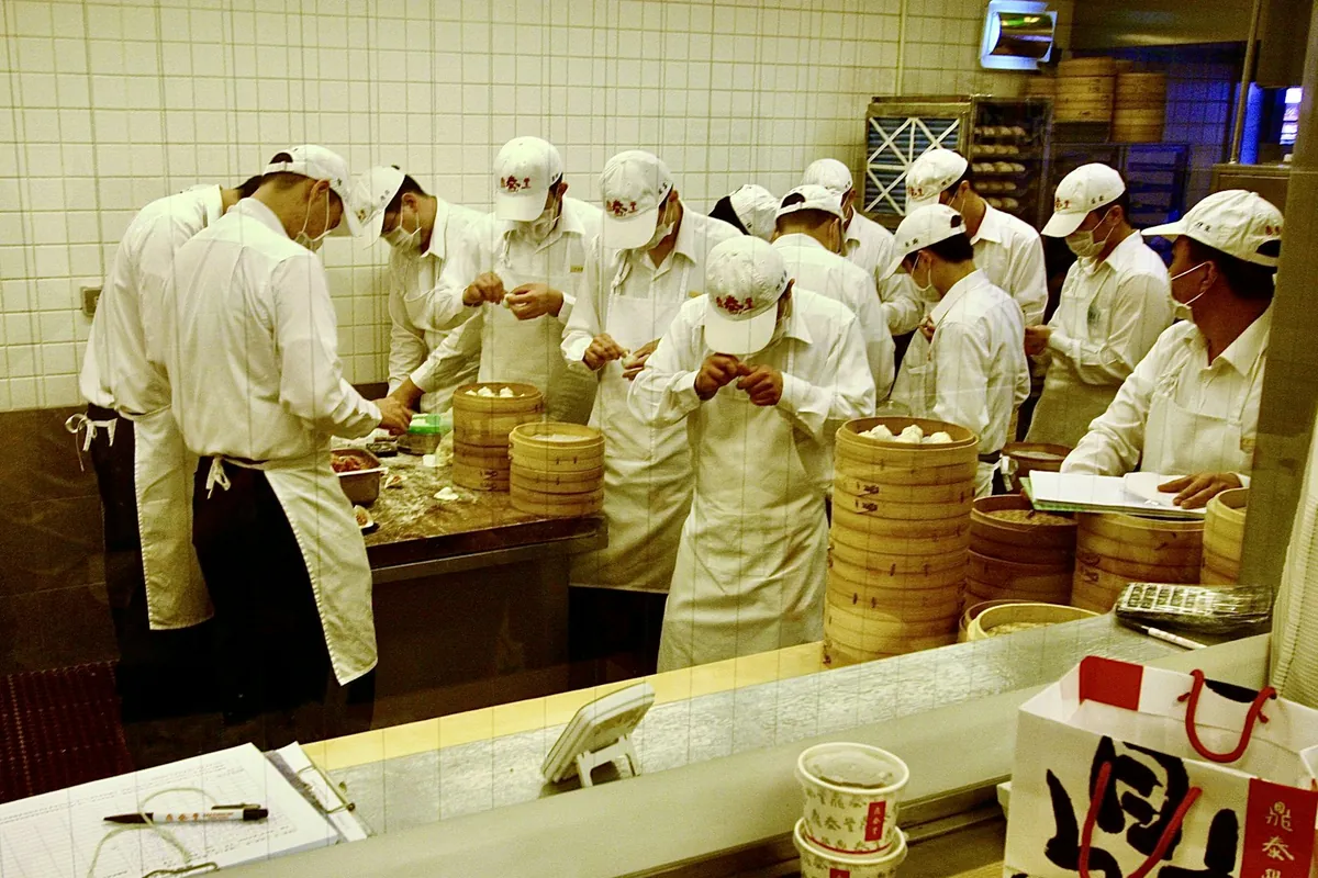 A close view of a pleated soup dumpling