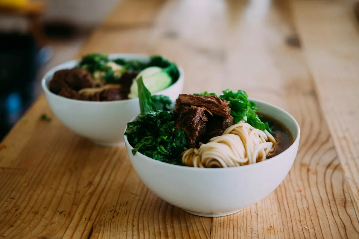 A pork dish among other Chinese dishes on a table