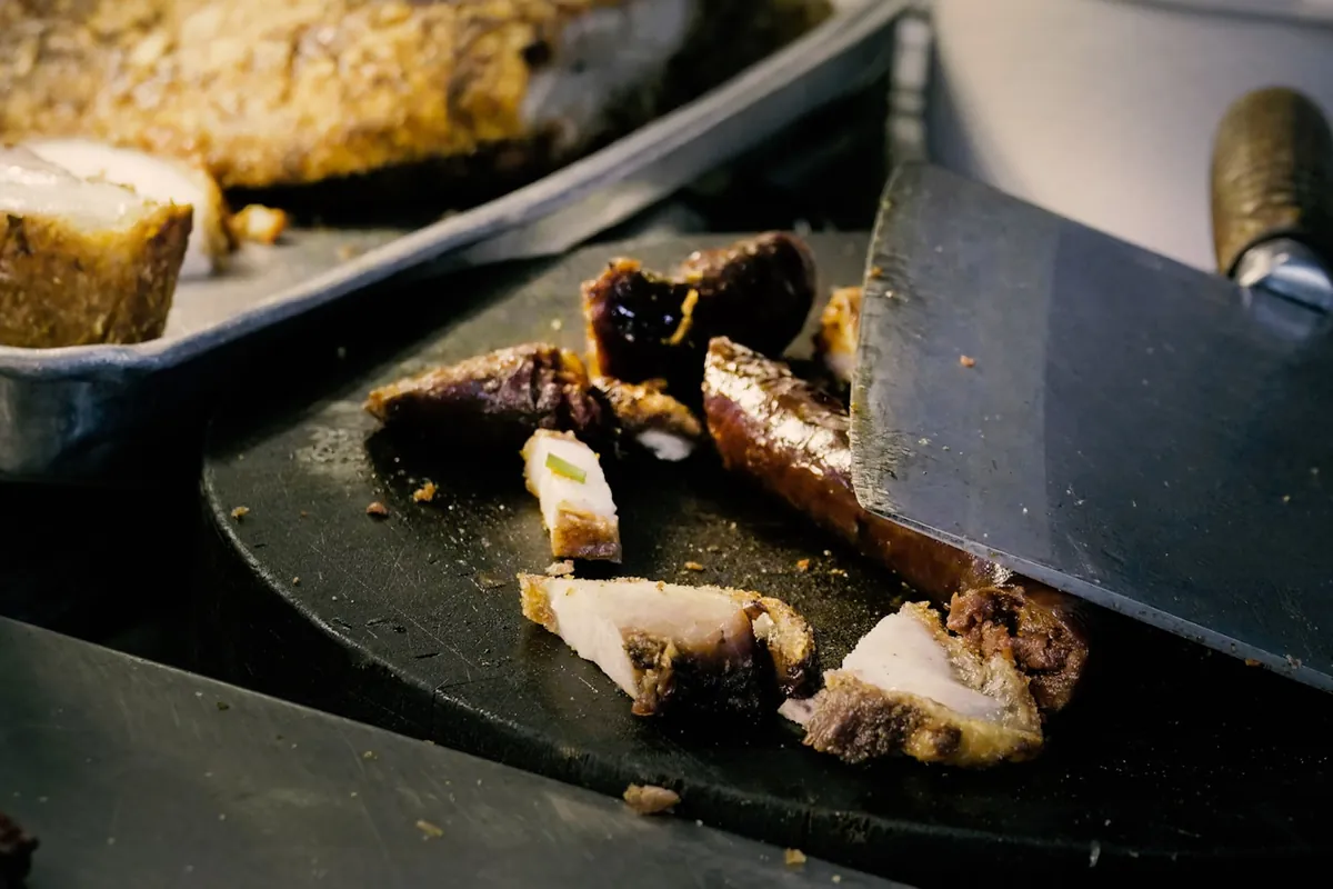 Close view of thin slices of roasted pork