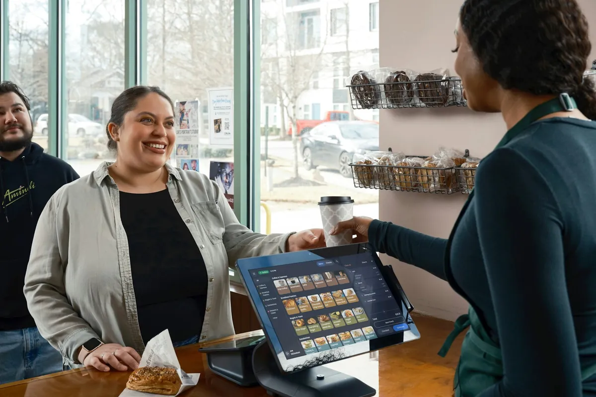 A customer asking a question at a counter
