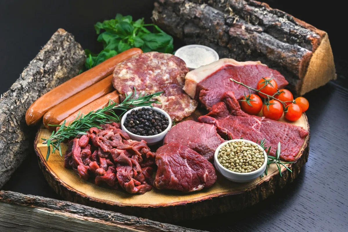 Plates of raw meat and vegetables for hot pot