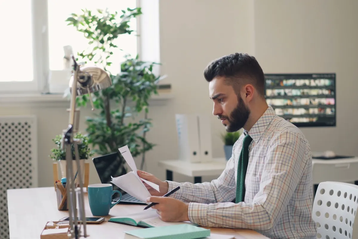 Someone reading a printed document
