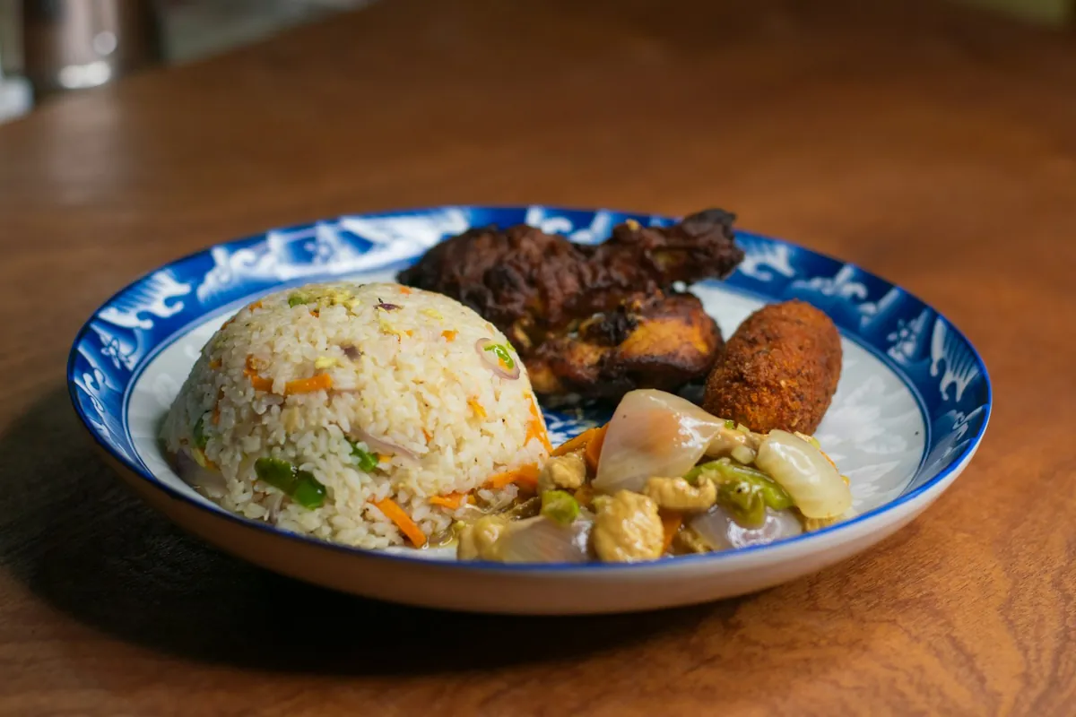 Ribs served on a plate with fried rice