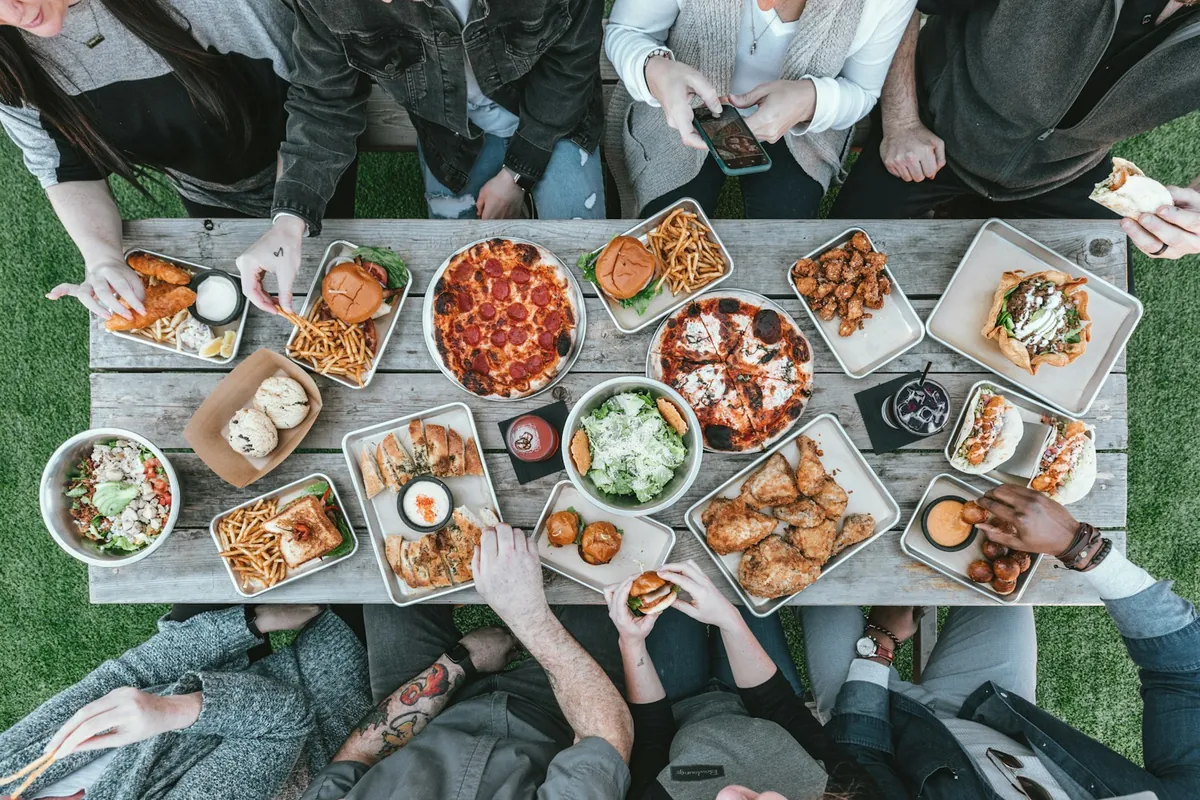 A plate of ribs being shared at a table