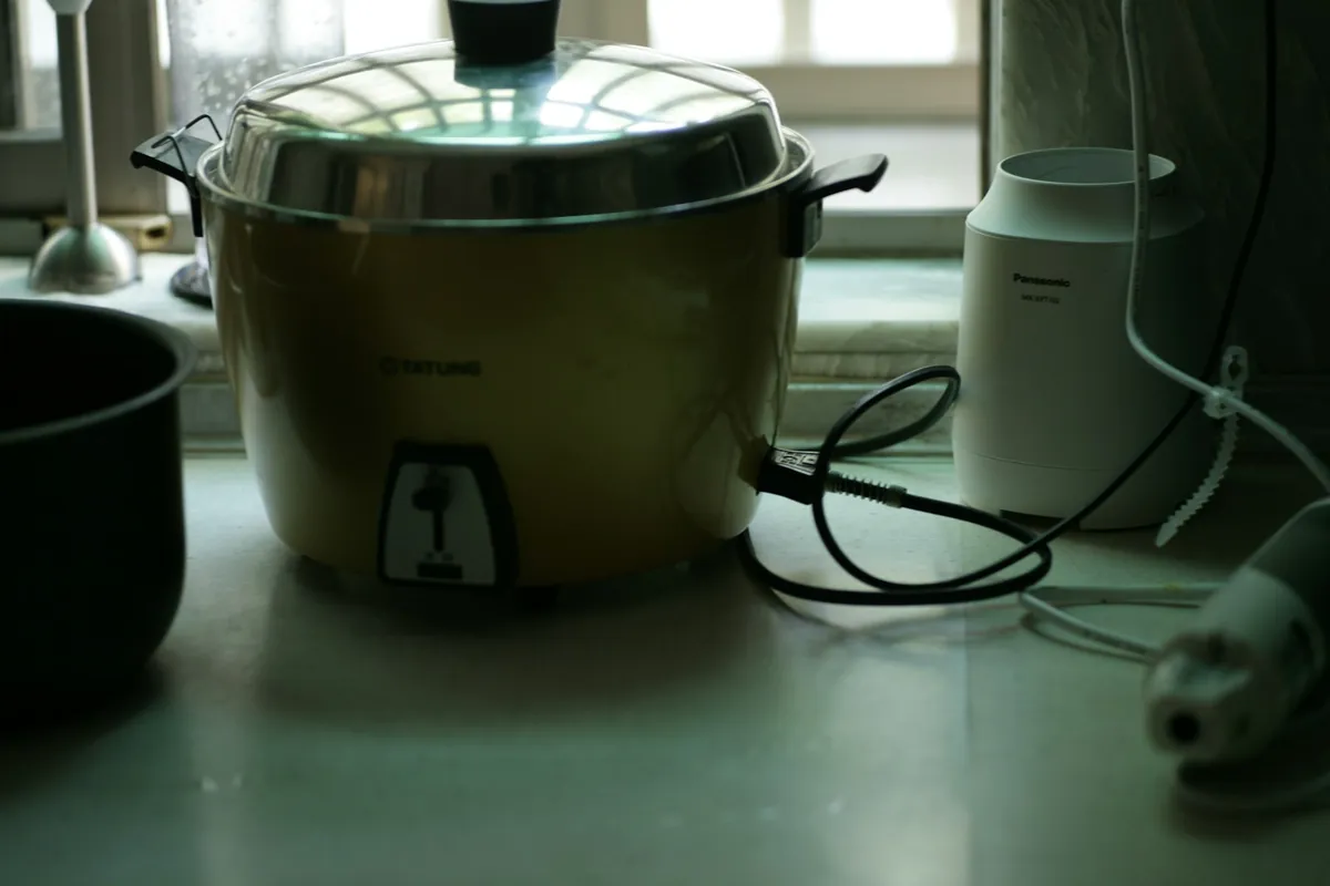 Rice simmering in a pot of water
