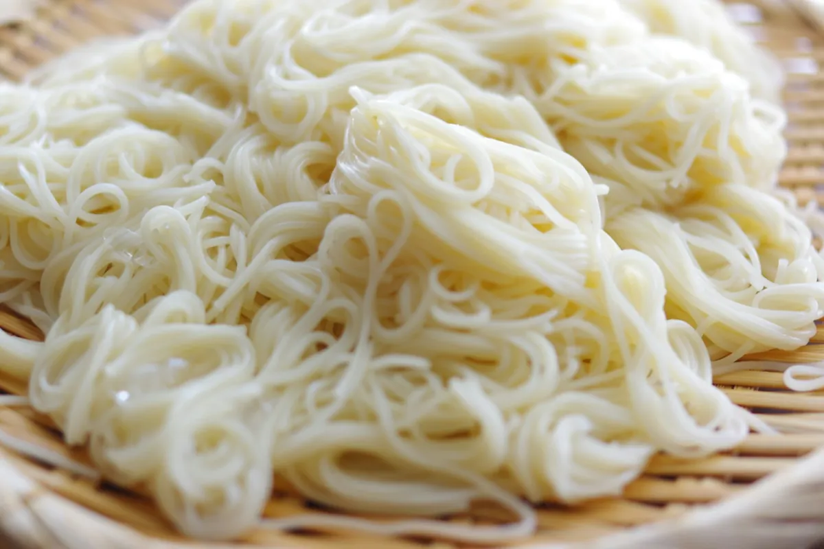 Cooked rice spread out on a tray to cool