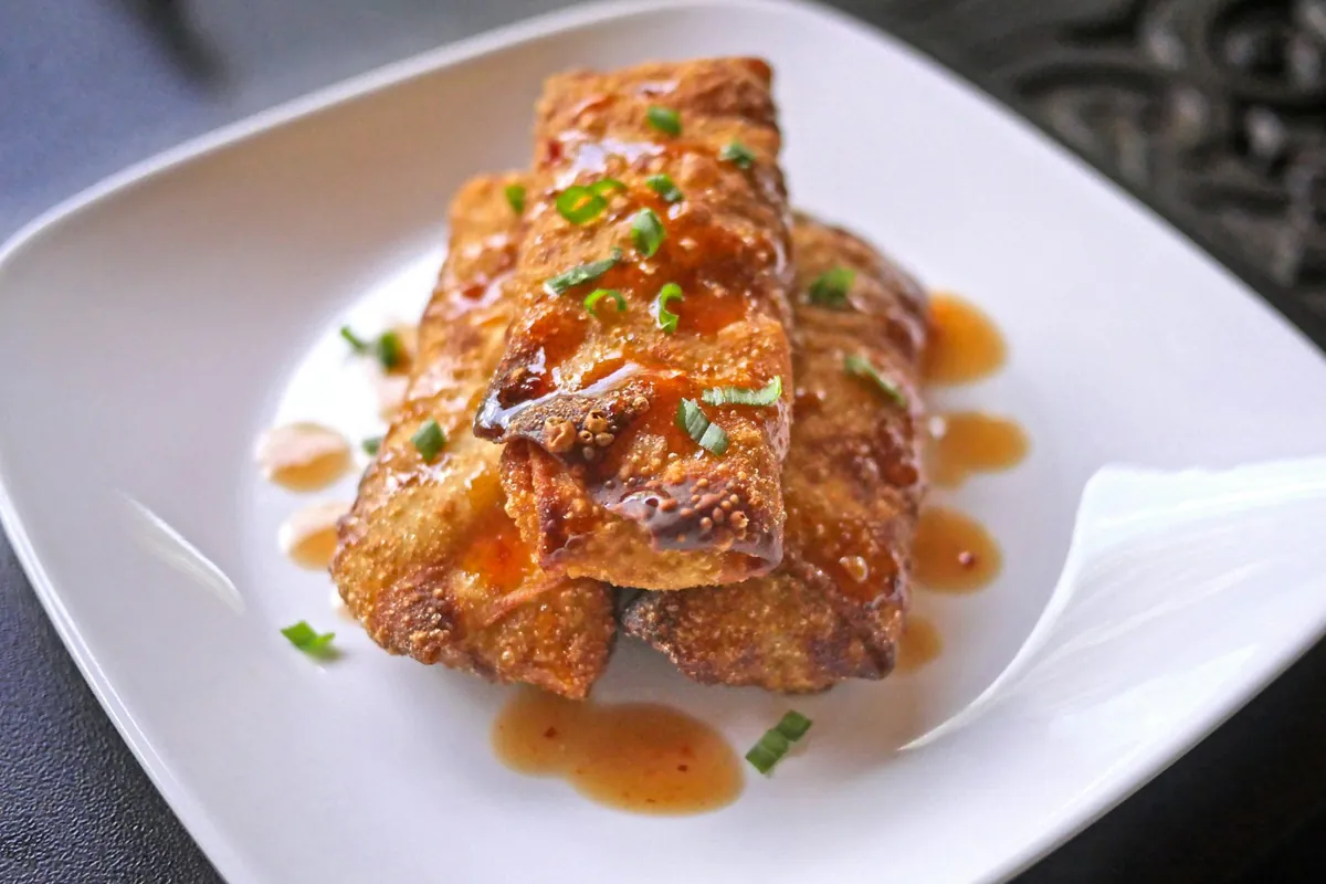 A fried roll cut open to show the filling inside