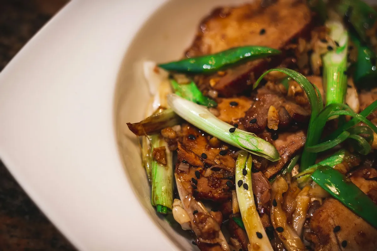 A sauced stir-fry served over rice