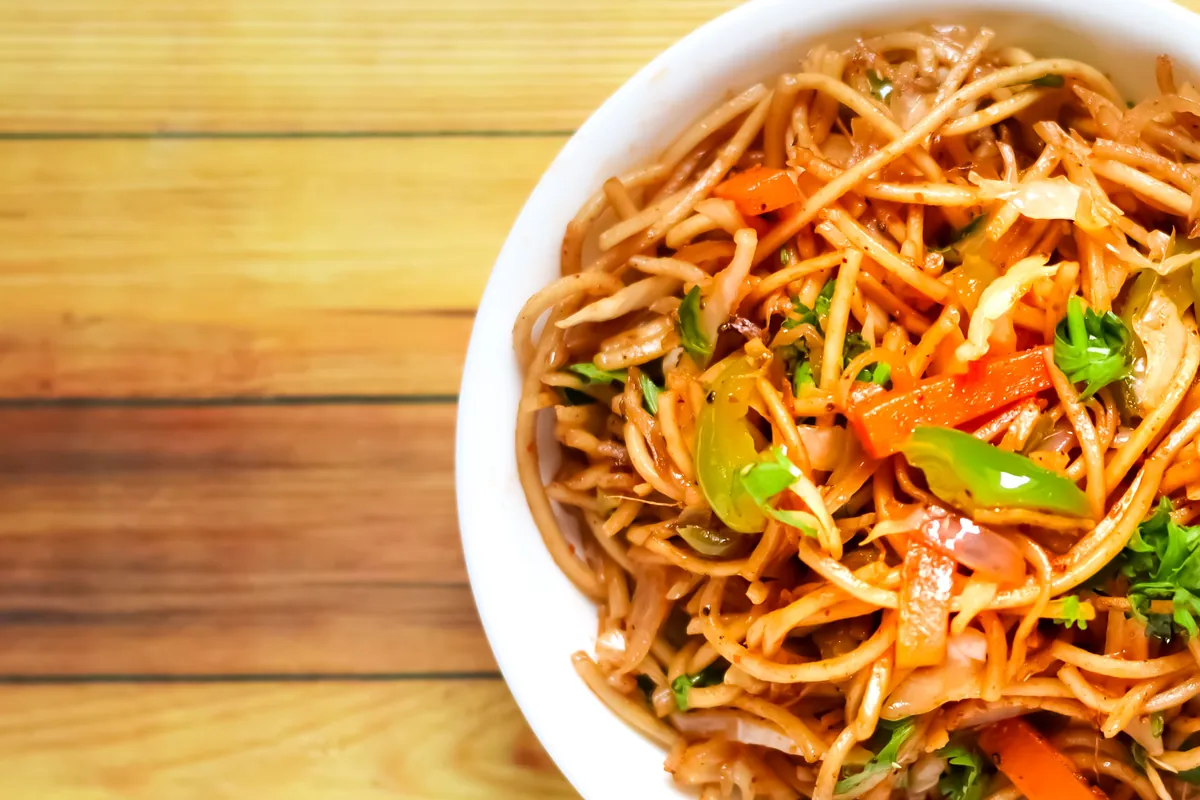 Soft wheat noodles coated in a glossy sauce